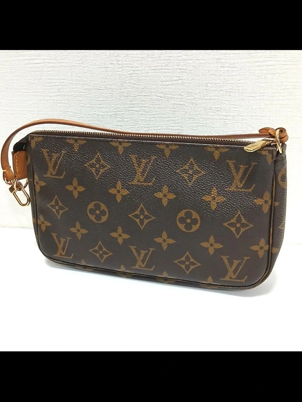 Louis Vuitton Monogram Canvas Mini Wristlet in Brown